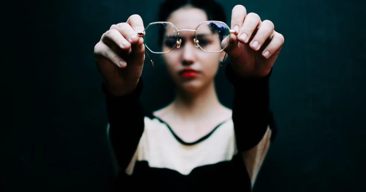Smart glasses with built-in camera and a glowing LED dot
