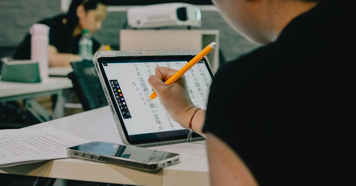 Students using tablets in modern Ecuadorian classroom