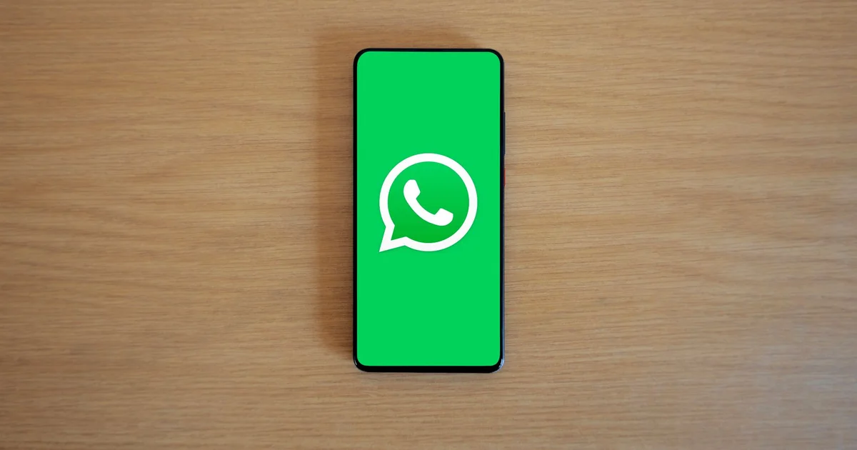 Smartphone showing WhatsApp Business conversation