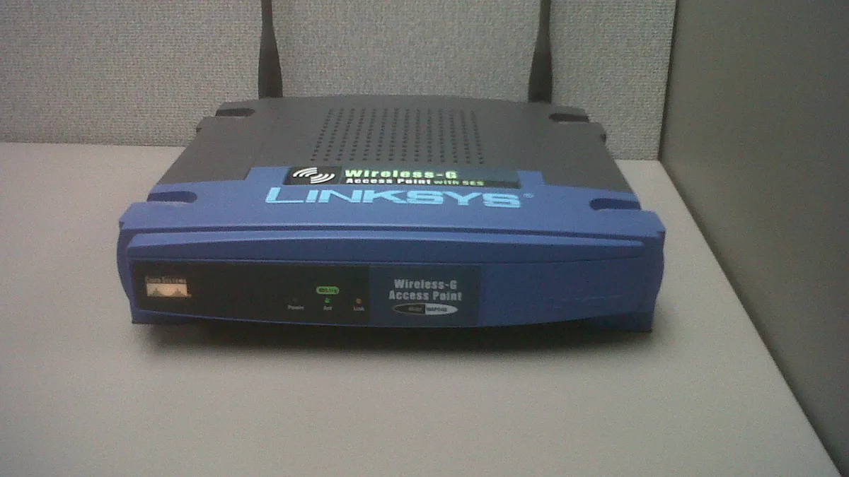 Wireless access point on a classroom ceiling with many connected devices