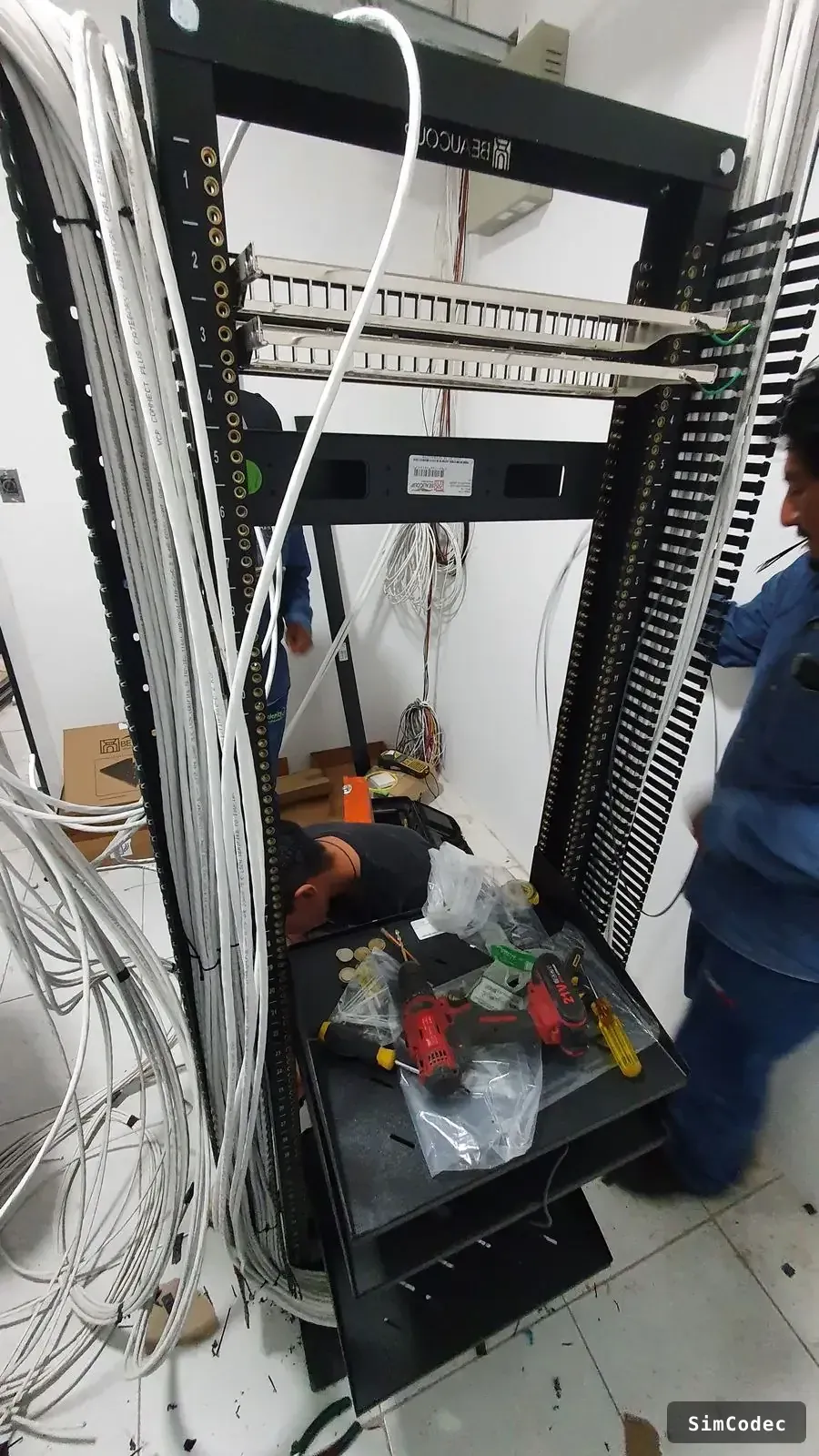 Team installing the rack