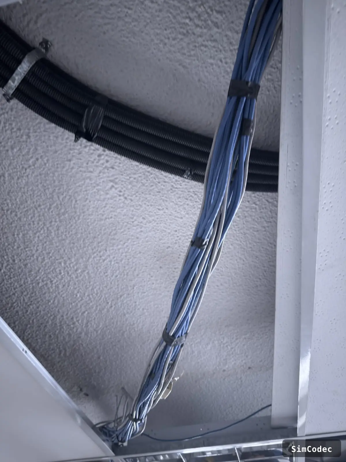 Cabling routed and secured overhead